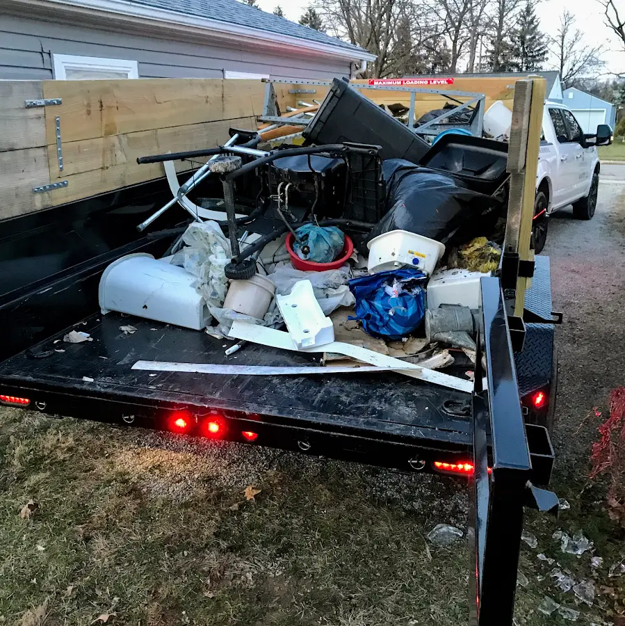 Roll-off dumpster delivered to a residential driveway in Key Largo