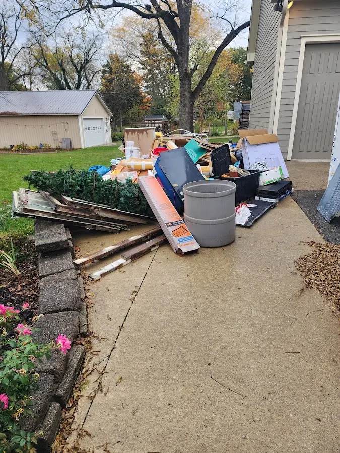 Dumpster being loaded with debris for 3 Yard Dumpster Rental in Key Largo